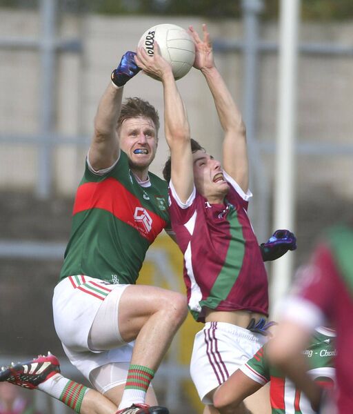 Graiguecullen's Mark Timmons and Portarlington Darragh Slevin rise high looking for possession in the SFC semi-final Photo: Denis Byrne