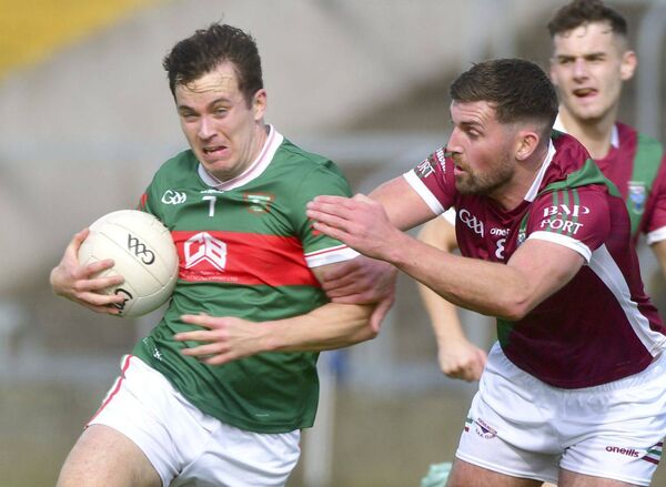 Keith Bracken (Portarlngton) moves in on Graiguecullen's Brian Byrne in an attempt to dispossess him Photo: Denis Byrne