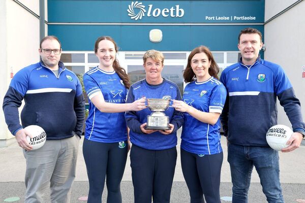 Martina Phelan Laois LGFA with St Conleth's players Aine Haberlin, Aoife Kirrane and management team of Chris Lynch and Eanna Delaney Photo: Paul Dargan