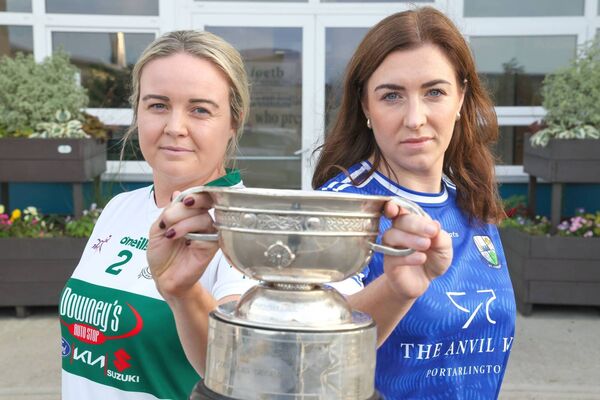 Portlaoise's Aisling Kehoe and St Conleth's Aoife Kirrane with the Laois LGFA senior championship trophy Photo: Paul Dargan