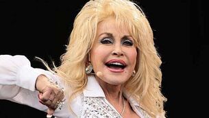 Dolly Parton says ‘I ain’t dead yet’ after sister prompts health concerns