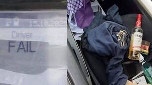 <p>A bottle of Paddy was in the passenger seat when Laois gardaí arrested a 'very drunk' driver. Photo: An Garda Síochána Laois-Offaly</p>