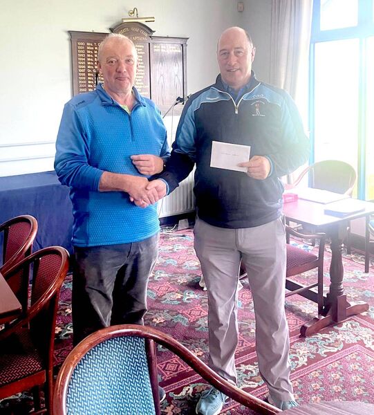 Cathal O'Donnell being presented with his prize by Society Captain Philip Monnelly Cathal O'Donnell being presented with his prize by Society Captain Philip Monnelly