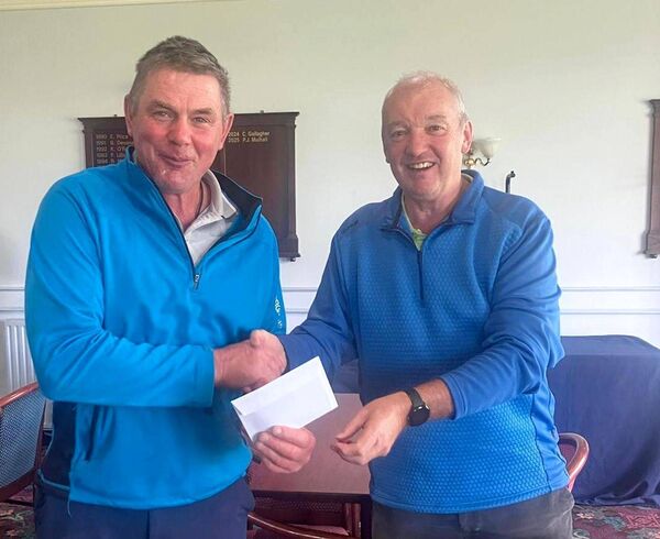 Paul Delaney receives his prize from Society Captain Philip Monnelly Paul Delaney receives his prize from Society Captain Philip Monnelly