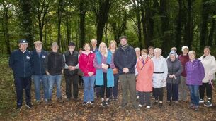 <p>Pictured are Dan Bergin and Majella Moore, Laois PPN with the Walking Group at Garryhinch Woods Photo: Denis Byrne</p>