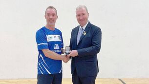 <p>Men's Golden Masters Wallball All-Ireland final runner-up Kevin Brennan (Laois) being presented with his medal by GAA Handball President Conor McDonnell </p>