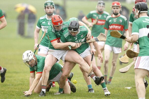 Ballyfin-Mountrath's Dylan Kelly and Rathdowney/Errill's Peter Maher tussle for possession in their U/20HC game Photo: David Maher
