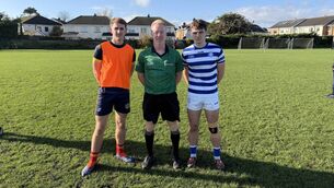 <p>Knockbeg College captain Énnae Byrne along with his St Fintans counterpart Tom Beary, and referee Paul Fahey</p> <p>Knockbeg College captain Énnae Byrne along with his St Fintans counterpart Tom Beary, and referee Paul Fahey</p>