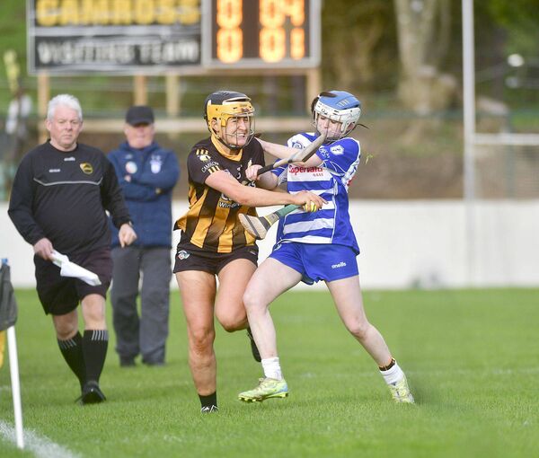 Aoife Collier (Camross) makes a determined drive to get past Ciara Ryan (Naas) in the Leinster Club Camogie semi-final tussle on Saturday Photo: Denis Byrne