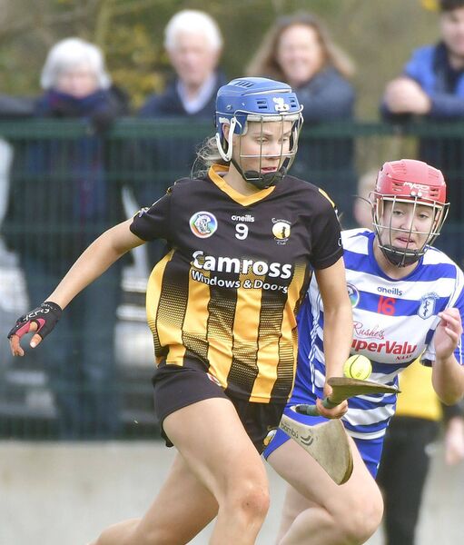 Amy Collier (Camross) breaking with Orlaith Delany (Naas) giving chase Photo: Denis Byrne