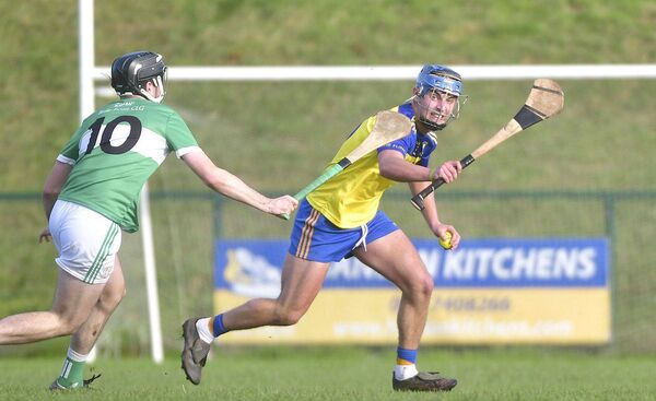 Liam O'Keeffe in possession for Abbeyleix with Shane Connolly (Ballyfin Mountrath) moving in to challenge Photo: Denis Byrne