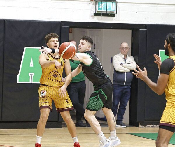 Portlaoise Panthers' Trevor Swayne makes a determined effort to stop Titan's Luke Herrick getting his pass away Photo: David Maher Portlaoise Panthers' Trevor Swayne makes a determined effort to stop Titan's Luke Herrick getting his pass away Photo: David Maher