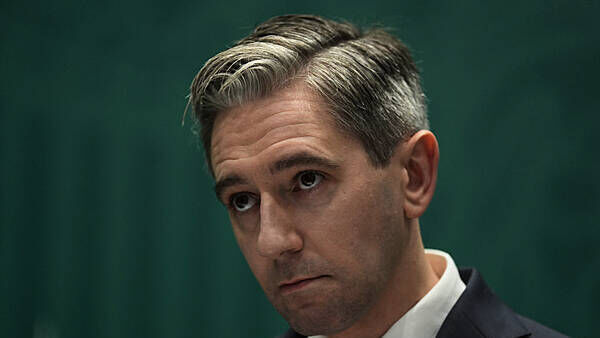 Woman in court accused of sending threatening messages to Tánaiste Simon Harris
