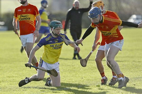 Jack Dunphy (Harps) and Jack O'Dea (Abbeyleix) vie for possession during the in the U/20 Hurling Championship semi-final on Sunday Photo: David Maher