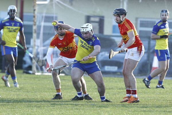 Eli Quinn (Abbeyleix) shakes off the attention of The Harps' Jack Kenney in the U/20HC semi-final Photo: David Maher