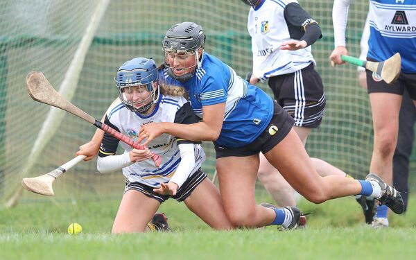 Camross' Kristen Keenan crash-tackles Leah Horan of Killimor Photo: ©INPHO/Leah Scholes