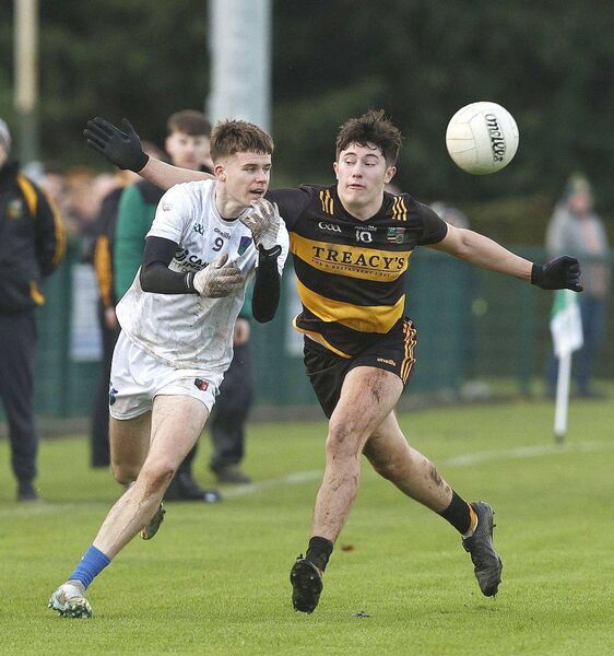 Jamie O'Connor (Courtwood-Emo) and Patrick O'Callaghan (The Heath) tussle for possession Photo: David Maher Jamie O'Connor (Courtwood-Emo) and Patrick O'Callaghan (The Heath) tussle for possession Photo: David Maher