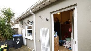 Mother and kids living in garden shed, waiting for social housing