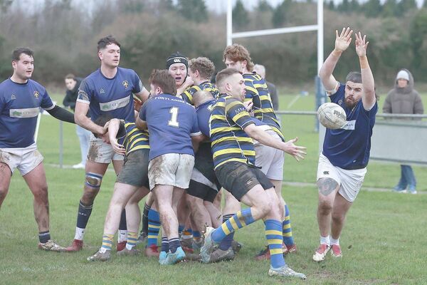 Eoin Keenan blocks down this attempted clearance by Midland Warriors Photo: David Maher