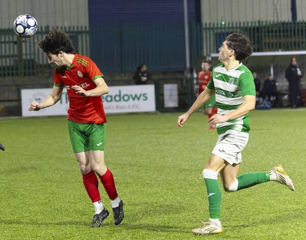 St. Patrick’s Joe Gordon heads clear of Killeshin’s Adam Farrell. St. Patrick’s Joe Gordon heads clear of Killeshin’s Adam Farrell.