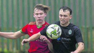 <p class="contextmenu internal_Caption">St. Patrick’s Jan Flejszar and New Oak’s Luke Ramsbottom in battle in their recent league tie.</p>