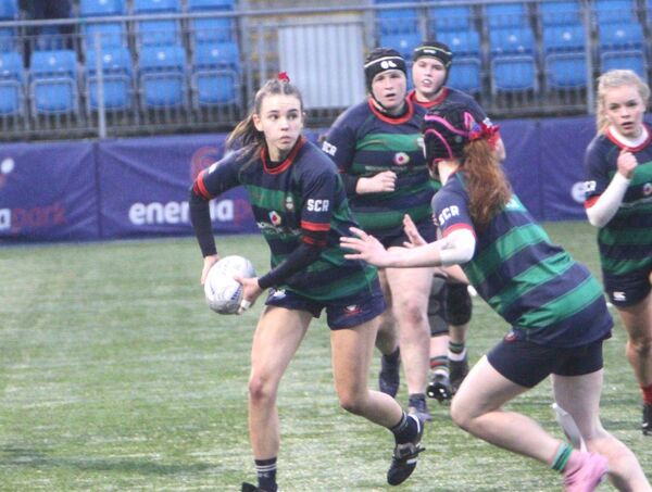 Scoil Chríost Rí out half Molly Fitzpatrick gets her pass away Photo: Jimmy Fitzpatrick