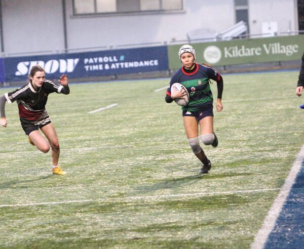Amarachi Obi shows this Ardscoil na Tríonóide defender a clean pair of heels Photo: Jimmy Fitzpatrick