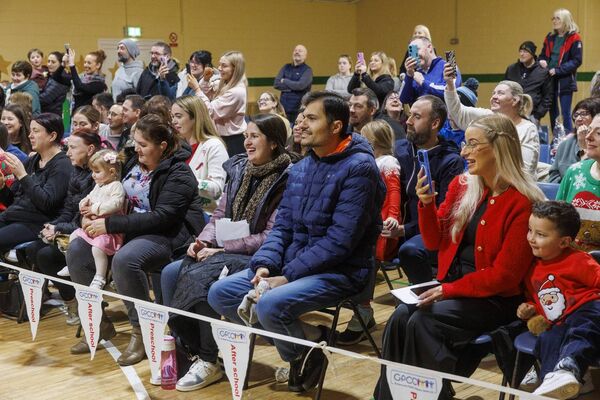 Parents and family members enjoying the show