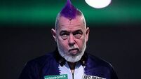 Peter Wright crashes out in round two after predicting he would win title
