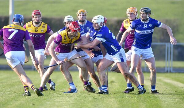 Eoin Gaughan (Laois) quite literally takes the sliotar from Wexford's Mike Kelly Photo: Denis Byrne