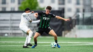 <p>Peter Grogan in action for Austin AC</p>