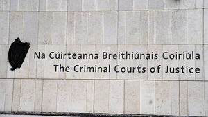 Extradited woman accused of helping plan gangland murder of Dublin father