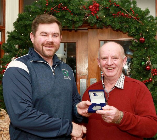 Craig Telford (Captain, Mountrath Golf Club) with M.J. Delaney, July Medal winner