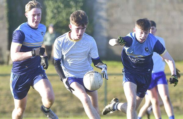 Sean Lalor (Mountmellick CS) breaking against Cross &amp; Passion Photo: Denis Byrne