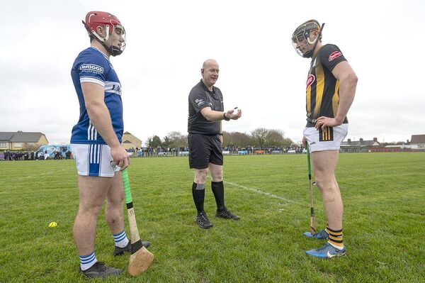 Captains David Dooley (Laois) and Darragh Corcoran (Kilkenny) with referee Gearoid Mac Graith for the coin toss on Sunday Photo: Denis Byrne Captains David Dooley (Laois) and Darragh Corcoran (Kilkenny) with referee Gearoid Mac Graith for the coin toss on Sunday Photo: Denis Byrne