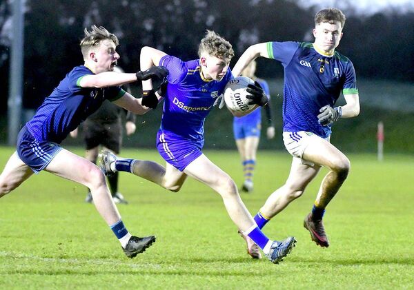 Oisin Dunne (Mountmellick CS) breaking on goal with Charlie Colleran and JJ Brady (Kilcoole) giving chase Photo: Denis Byrne