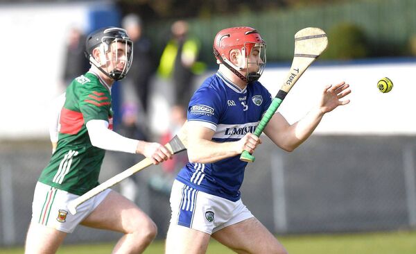 Laois's Tomás Keyes snatches the sliotar ahead of Mayo's Jack Trench during their NHL Division 2 game on Sunday Photo: David Farrell Photography 