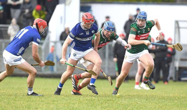 Mayo's Eoghan Collins and Eoin Ryan in a race for possession with Laois's Jack Kelly and David Dooley during the NHL tie at Tooreen on Sunday Photo: David Farrell Photography 