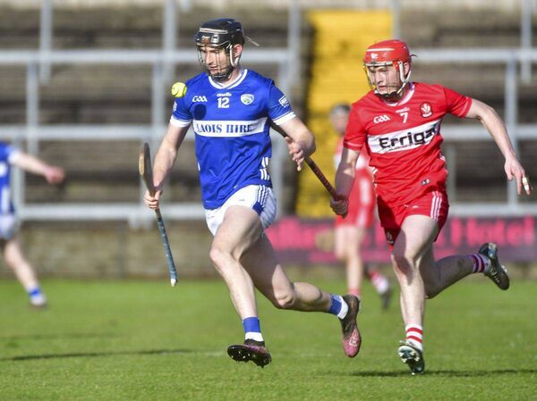 Aaron Dunphy (Laois) breaking away from Derry's Eamon Cassidy during their NHL game at Laois Hire O'Moore Park on Sunday Photo: Denis Byrne Aaron Dunphy (Laois) breaking away from Derry's Eamon Cassidy during their NHL game at Laois Hire O'Moore Park on Sunday Photo: Denis Byrne