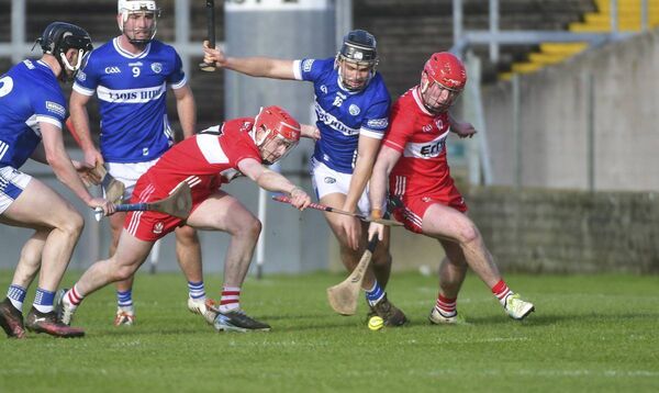 Laois's Eoghan Murphy competes with Eamon Cassidy and Michael Lynch (Derry) on Sunday Photo: Denis Byrne Laois's Eoghan Murphy competes with Eamon Cassidy and Michael Lynch (Derry) on Sunday Photo: Denis Byrne
