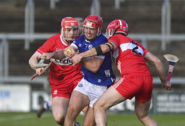 Laois captain David Dooley pushes past this challenge from Patrick Turner (Derry) Photo: Denis Byrne Laois captain David Dooley pushes past this challenge from Patrick Turner (Derry) Photo: Denis Byrne