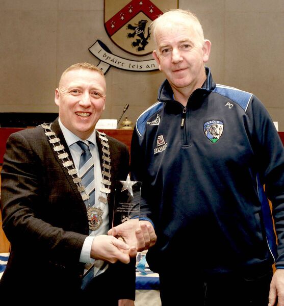 Cathaoirleach Cllr Barry Walsh makes a presentation to Pat Collier (Joint Team Manager Laois Camogie Team)