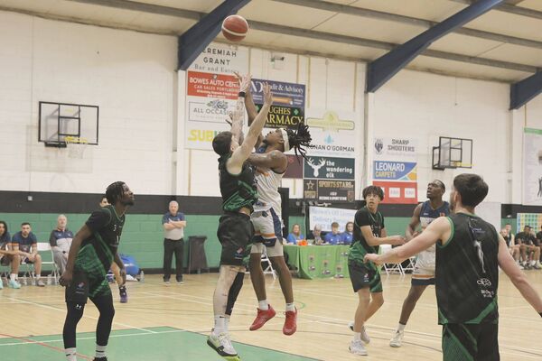 Trevor Swayne (Portlaoise Panthers) and Vernon Deshaun (Drogheda Wolves) vie for this ball in St Mary's Hall Photo: David Maher