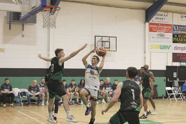 Portlaoise Panther's Davin McEvoy attempts to block Dimitrois Theocharis (Drogheda Wolves)