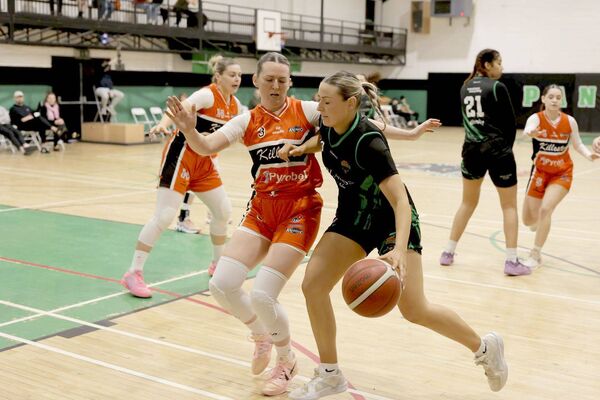 Portlaoise Panthers' Lynn Tunnah rounds Killester's Michelle Clarke in their Women's Super League game in St Mary's Hall on Sunday Photo: David Maher