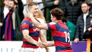 <p>Conor Kelly celebrates with Clontarf team mate, and former Portlaoise player, Will Reilly after kicking the winning conversion against Terenure last season Photo: ©INPHO/Andrew Conan</p>