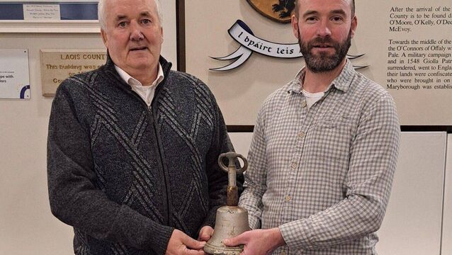 <p>Laois Heritage Officer Thomas Carolan (right) and local historian Noel Burke with the Clonkeen Bell. Photo: James G. Carroll</p>