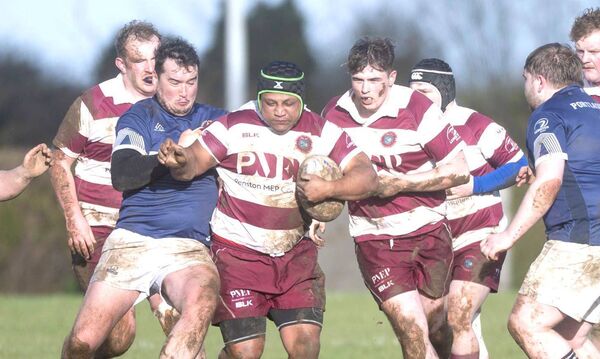 Portlaoise's Liam Doyle attempts to put a stop to Portarlington's Toby Neilson Dry's rampaging run Photo: Denis Byrne