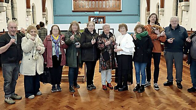 <p>The 11 artists with their chockolate bone-shaped treats are Kevin McCann (curator) Antoinette Breen, Mary Slevin, Kate Knowles, Kathleen Gilligan, Margaret Deegan, Mauri Byrne, Aisling Conroy (standing in for her mother Marie Conroy) Mark Fisher with exhibition mascott Holden) Liam Phelan and Mike Rafter Photo: Stan Henderson</p>
