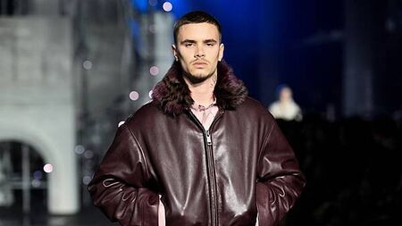 Romeo Beckham and Rosie Huntington-Whiteley on catwalk at London Fashion Week